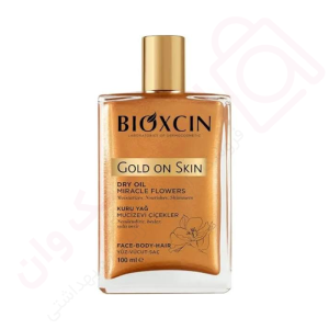 روغن مرطوب کننده و براق کننده صورت و بدن و مو بیوکسین مدل Gold On Skin حجم 100 میل